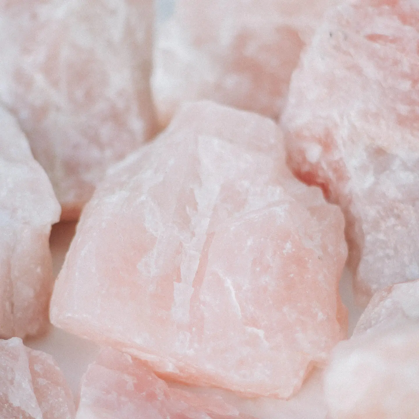 Close-up of raw rose quartz stones for aromatherapy