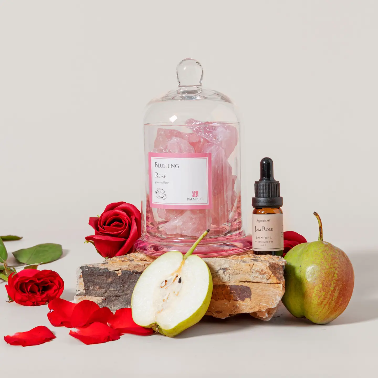 Glass dome diffuser on natural fabric with rose quartz and fragrance